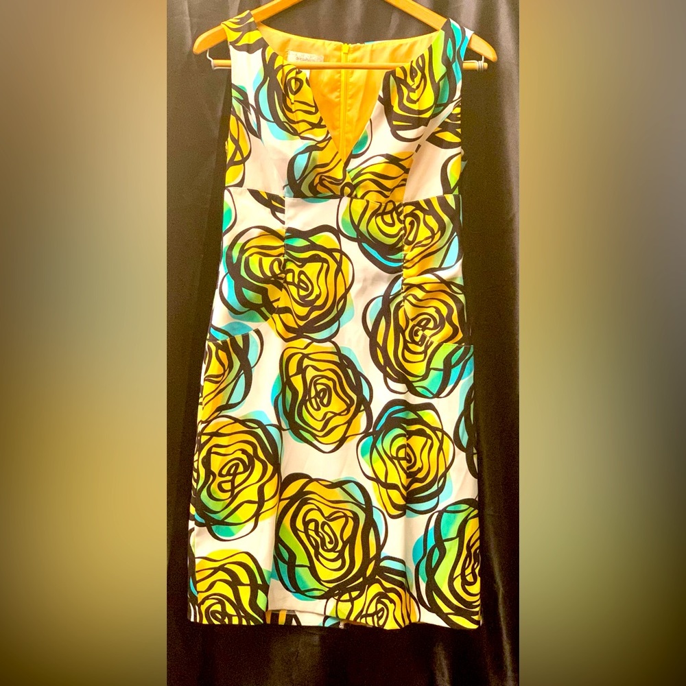 Flora dress good for any semi formal occasion. Knee length. Figure flattering.